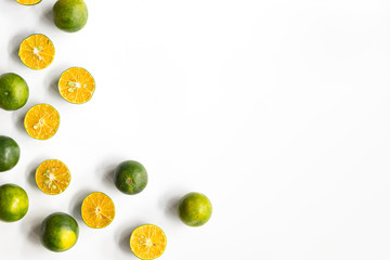 Top view, flat lay of fresh mandarin oranges on white background with copy space.