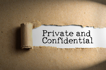 Torn paper with word Private and Confidential