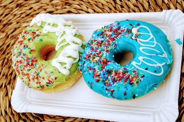 Delicious donuts with colorful chocolate