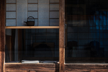 Fototapeta na wymiar wooden wall of window and old house in Japan. low key and soft focus.
