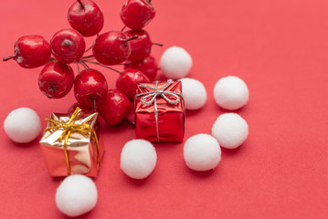 Christmas gift boxes on a red shiny background
