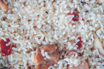 Typical Spanish meat and squid paella