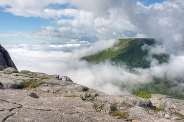 View over the misty valley, on the edge of the cliff, Quebec, Canada