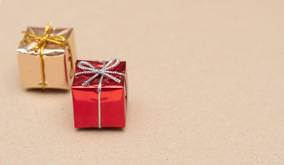 gold and red gift boxes on craft paper background