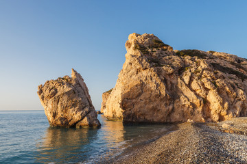 Aphrodite's Rock - Aphrodite's birthplace near Paphos City. The rock of the Greek Petra tou Romiou. Cyprus island, morning time.
