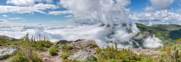 View over the misty valley, on the edge of the cliff, Quebec, Canada