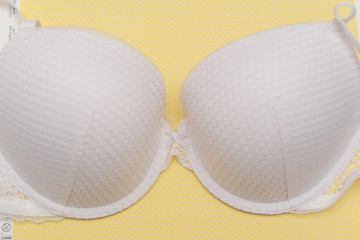 white bra on yellow background