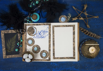Book of shadows opened on a page with New Moon ritual