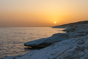 View of the iconic seascape with white rocks. Cyprus, sunset.