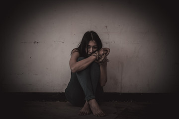 Asian hostage woman Bound with rope at night scene,The thieves kidnapped for ransom,thailand people