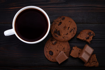 Chocolate cookies on wooden table.Homemade food on wooden background