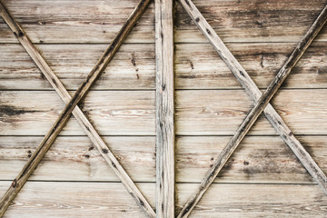 Fototapeta premium Wooden barn door texture. Rustic desks brown wall background.