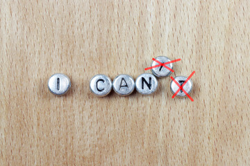 I can in plastic letters on a wooden background