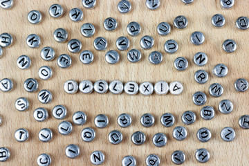 word dyslexia plastic letters on a wooden background