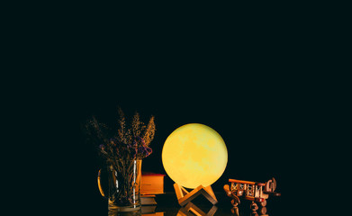 decoration of vintage airplane toy with moon light on the table