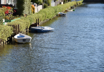 Fototapeta na wymiar Rowboats and docks by homes