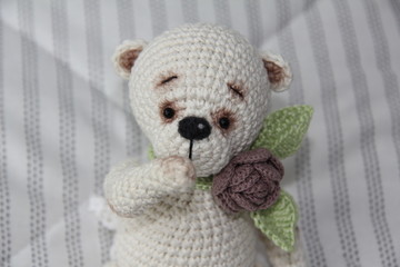 Teddy bear sitting on the blanket