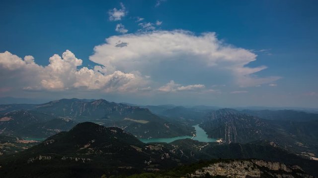 Timelapse of clouds forming over Baells reservoir and Pyrenees mountains near Berga, Barcelona, Spain