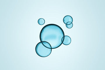 Micellar water aqua bubble on blue background with separate clipping path