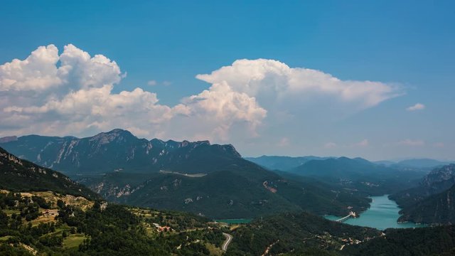 Timelapse of clouds forming over Baells reservoir and Pyrenees mountains near Berga, Barcelona, Spain