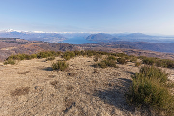 View of the Maggiore lake with the alps on the background, Piedmont, Italy.