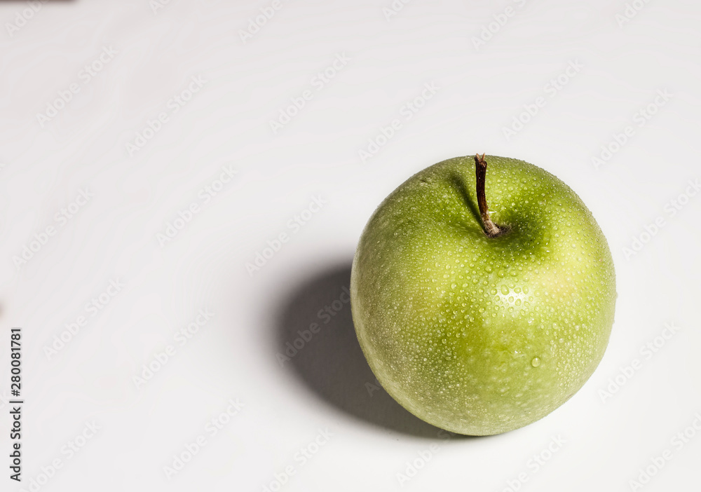 Wall mural Green apple on white background