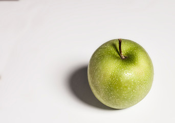 Green apple on white background