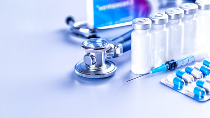 Drug prescription for treatment medication. Pharmaceutical medicament, cure in container for health. Pharmacy theme, capsule pills with medicine antibiotic in packages. Stethoscope