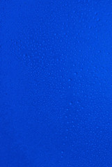 small drops of water on blue background