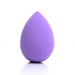 purple egg sponge on white background with reflection