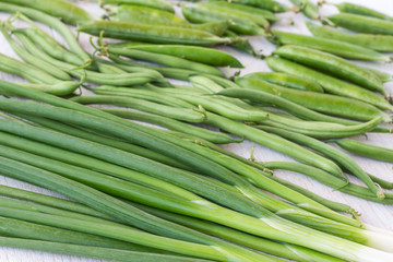 A set of green vegetables: onions, peas, asparagus, top view