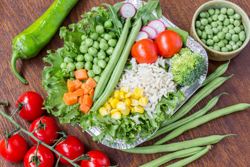 A set of vegetables with rice for a healthy diet: corn, peas, asparagus, carrots, broccoli, lettuce