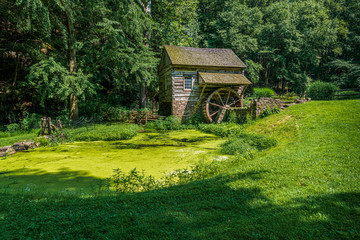 Old wooden house with a water wheel