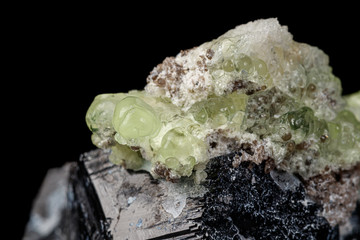 Macro stone Hyalite mineral, tourmaline Sherl, smoky quartz on a black background