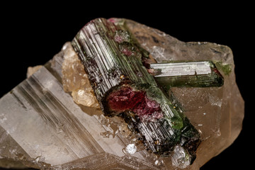Macro stone tourmaline mineral on a black background close up