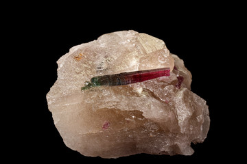 Macro stone tourmaline mineral on a black background close up