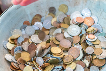Old antique coins on display in antique shop