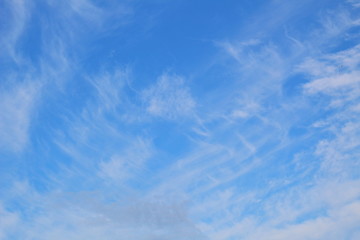 Light cirrus clouds on a blue sky. Natural background.