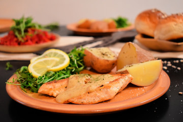Chicken white meat with cheese and vegetables.