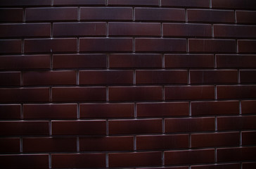 background of dark red brick close up