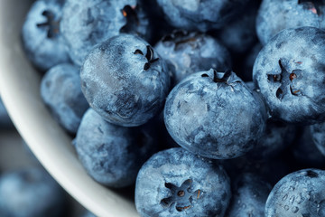 Fresh selected blueberries in bowl, close-up