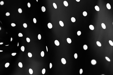 Vintage polka dot textile background texture, white dots on black luxury fabric design pattern © Anneleven
