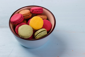 view on a table and a bowl with macaroons