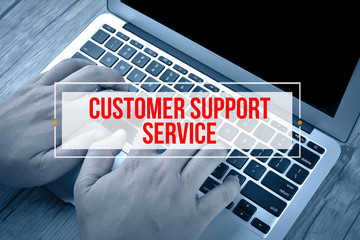 Hand Typing on keyboard with text CUSTOMER SUPPORT SERVICE