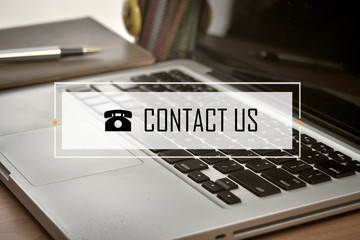 Notebook and Laptop with text CONTACT US