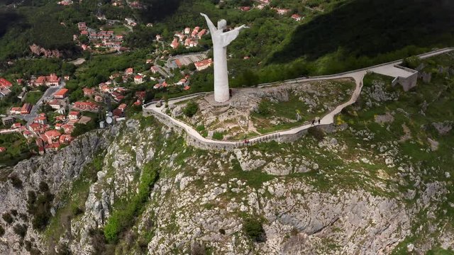 View at green hill with statue in Maratea town in Italy