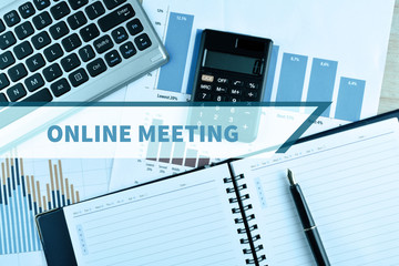 Notebook and Laptop with graph and charts with word Online Meeting