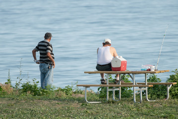Fototapeta premium unknown fishermen have spotted something in the water nearby