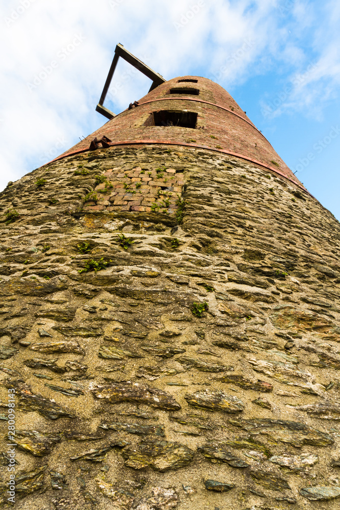 Wall mural Derelict windmill, looking up, portrait