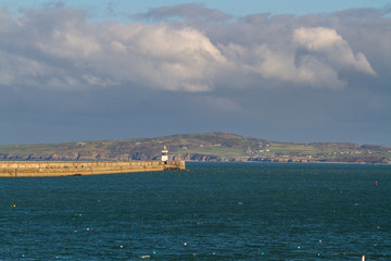 Naklejka na ściany i meble Holyhead breakwater Lighthouse in Anglesey, Wales, from Holyhead